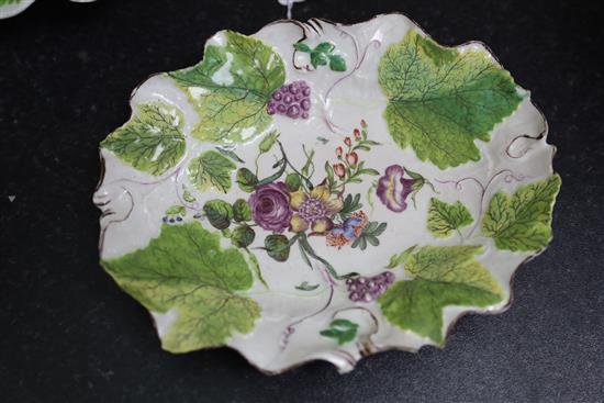 A pair of Chelsea botanical vine leaf dishes, c.1755 and a a pair of similar Bow dishes, c.1758, W. 21.5cm and 26cm, one Bow dish repai